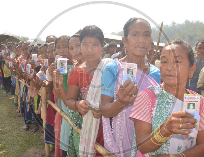 Indian Woman Showing Voter ID Cards by Standing In Queue Lines For Casting Vote in Assam Assembly Elections 2016