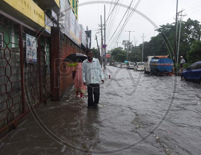 Pedestrians Walking On Flooded Roads Due to  Floods in Guwahati City, Assam