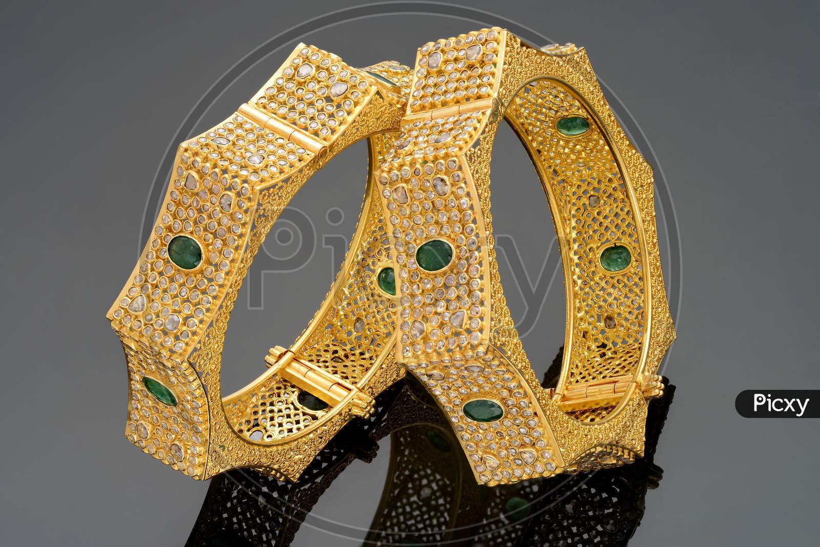 Greem gemstone embedded Gold Bangles
