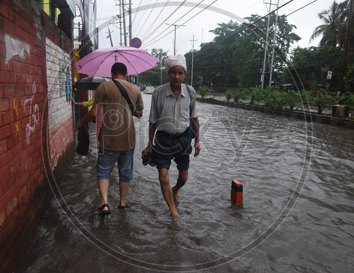 Pedestrians Walking On Flooded Roads Due to  Floods in Guwahati City, Assam