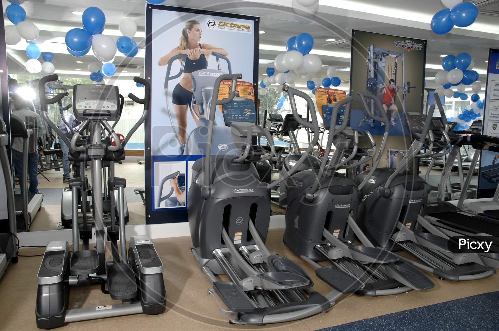 Group of exercise machines in a row at Gym