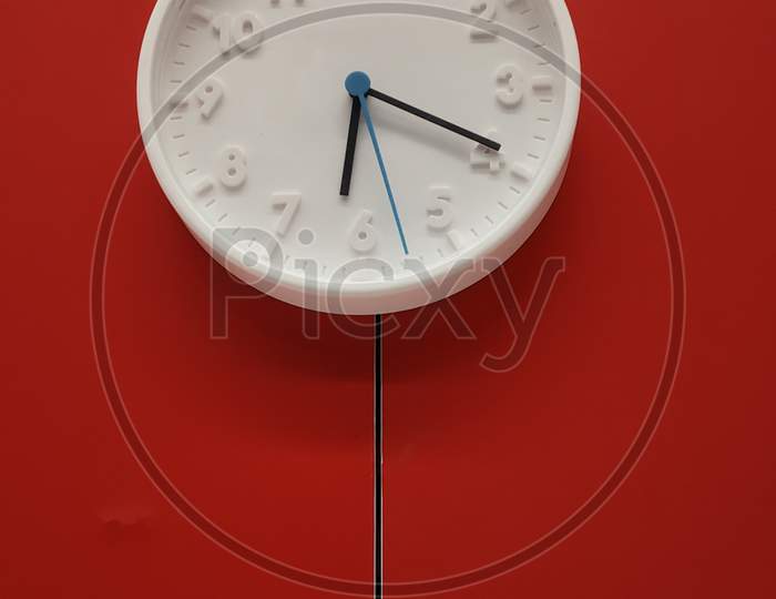 Wall Clock Over a Red Wall Wall Clock Over a Red Wall