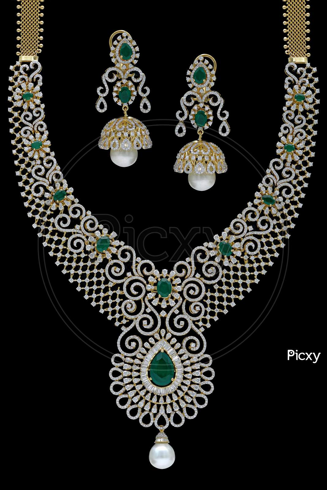 Indian Emerald Jewelry necklace set on a black background