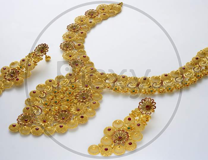 A Gold Necklace piece with diamonds