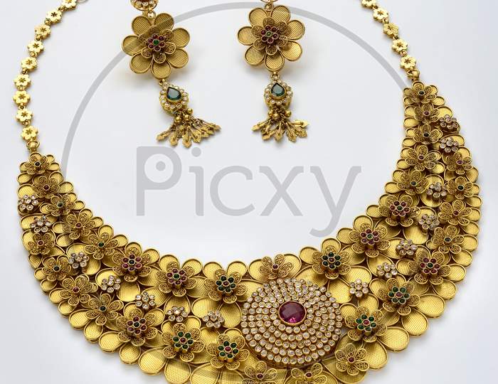 A Gold Necklace set with earring set