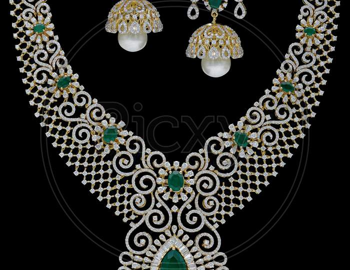 Indian Emerald Jewelry necklace set on a black background