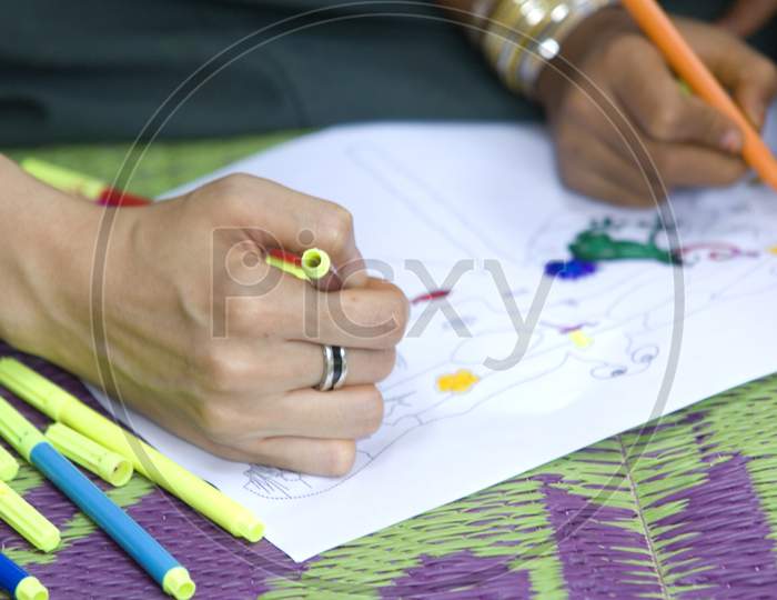 Indian teacher teaching drawing