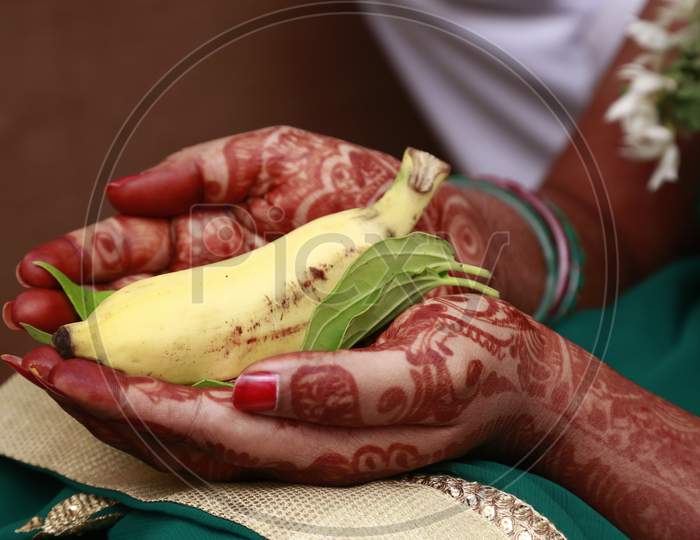Indian bride holding Banana in her hand
