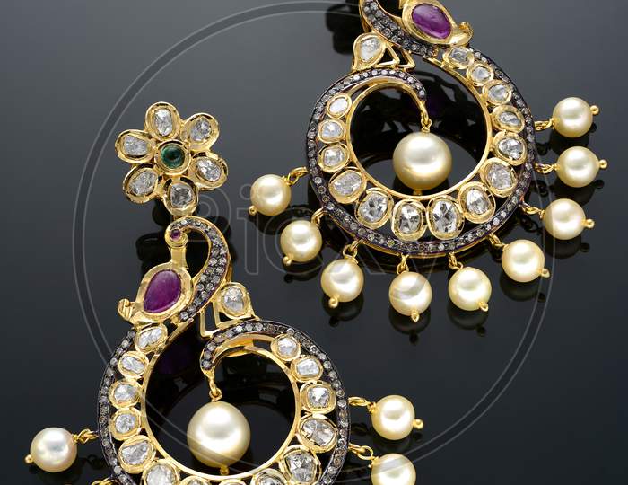 Heavy gemstone embedded earrings set