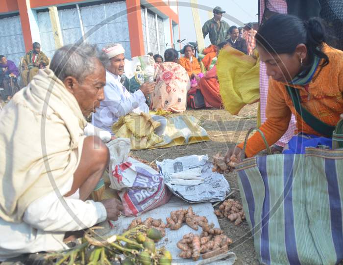 Assamese Woman  Purchasing Fresh Vegetables And Spices From Local Village Market in Morigaon , Assam