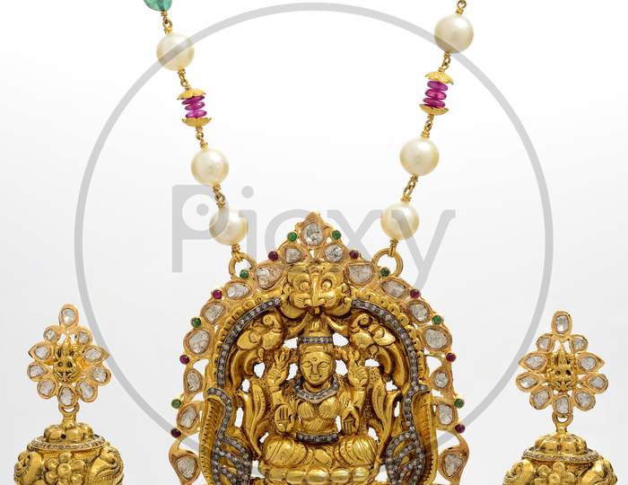 Goddess pendant with matching gold earrings