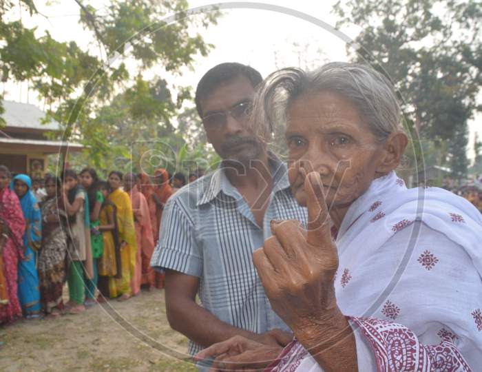 An Old  Woman  Showing  Inked Finger After Casting Vote  in Assembly Elections 2016