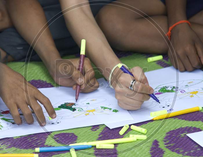 Students sketching along with the teacher