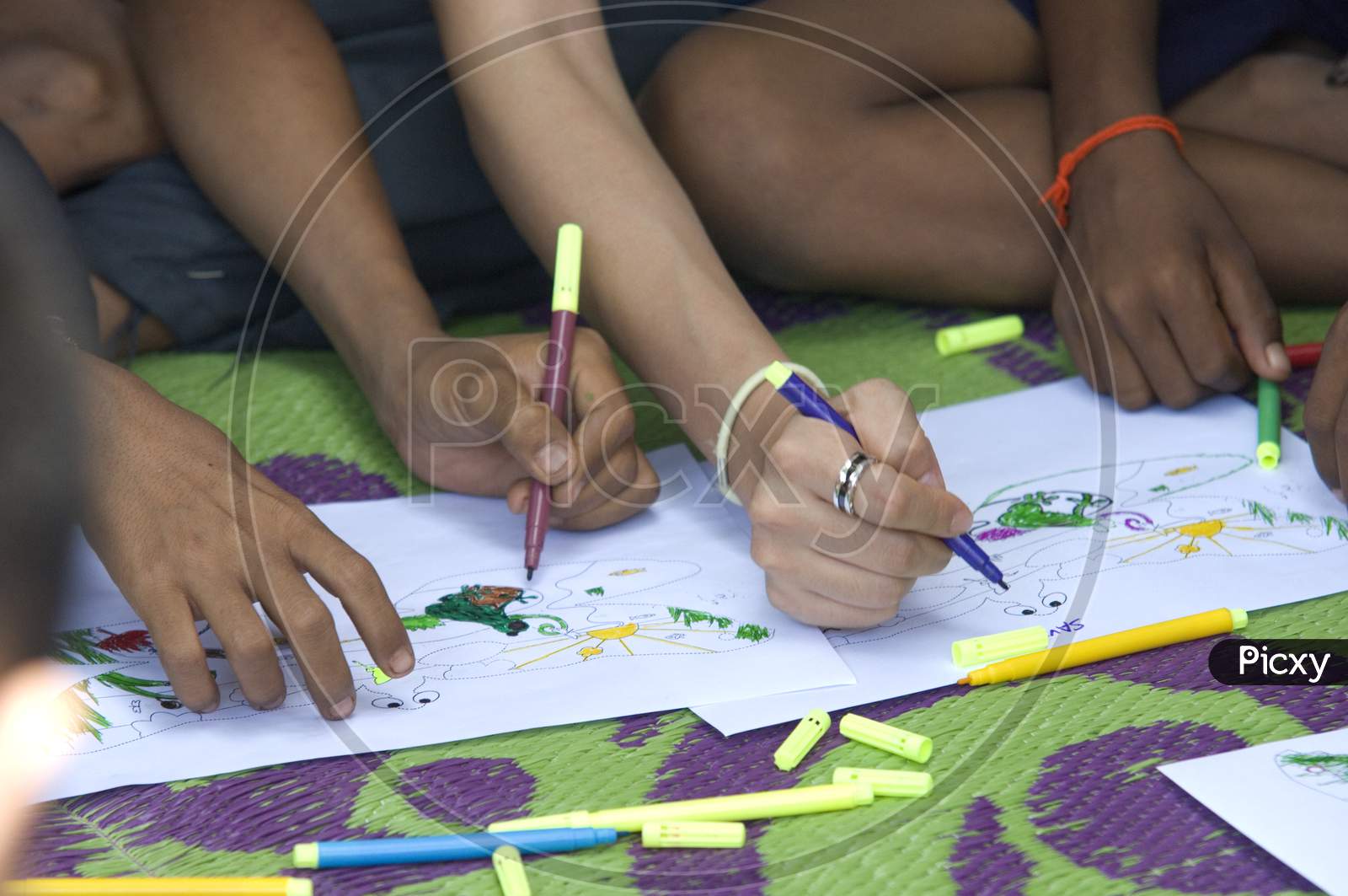 Students sketching along with the teacher