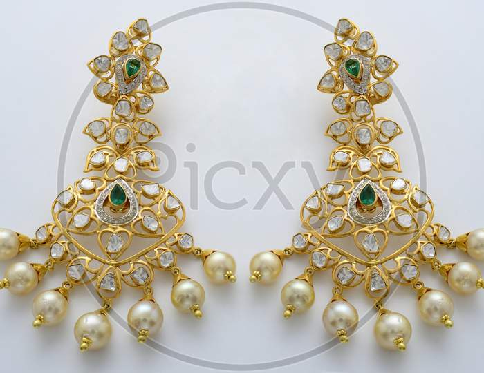 Gold coated earrings with gemstones
