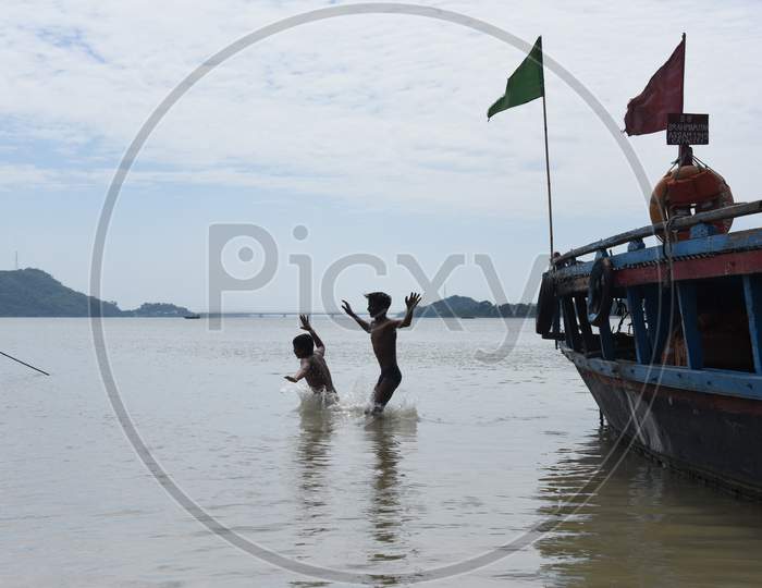 Young  Indian Boys Swimming in Bramaputra River