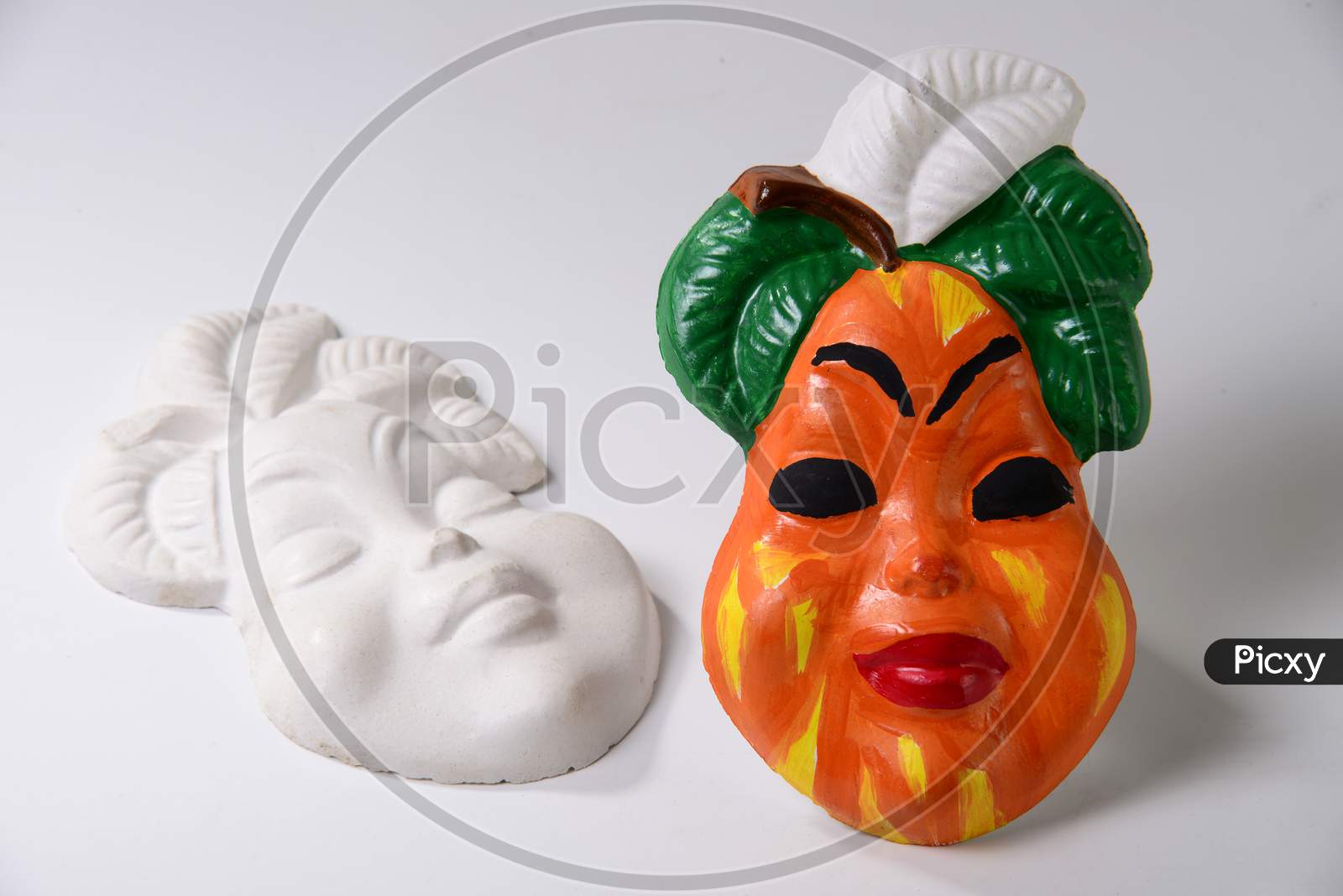 Decorative fruit specimen with a face