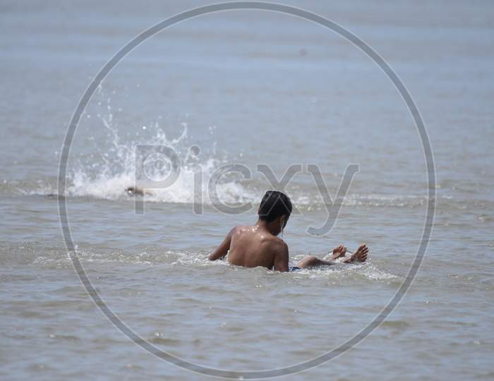 Young  Indian Boys Swimming in Bramaputra River