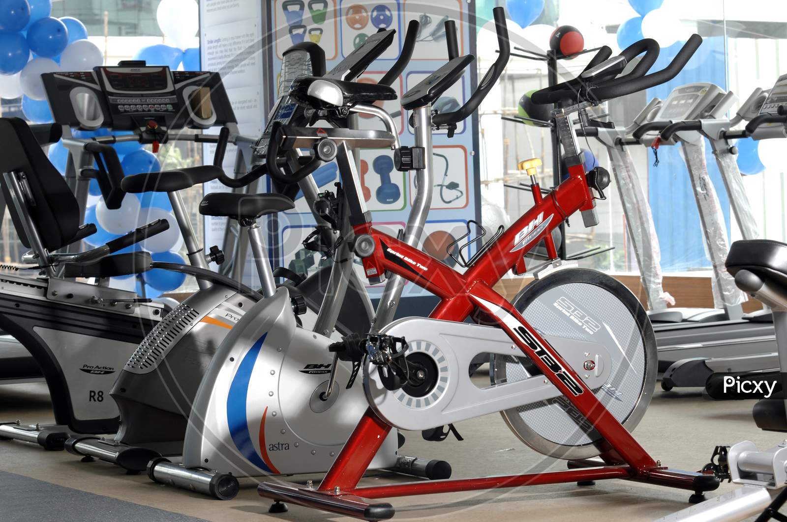 Group of cycling exercise machines in a gym