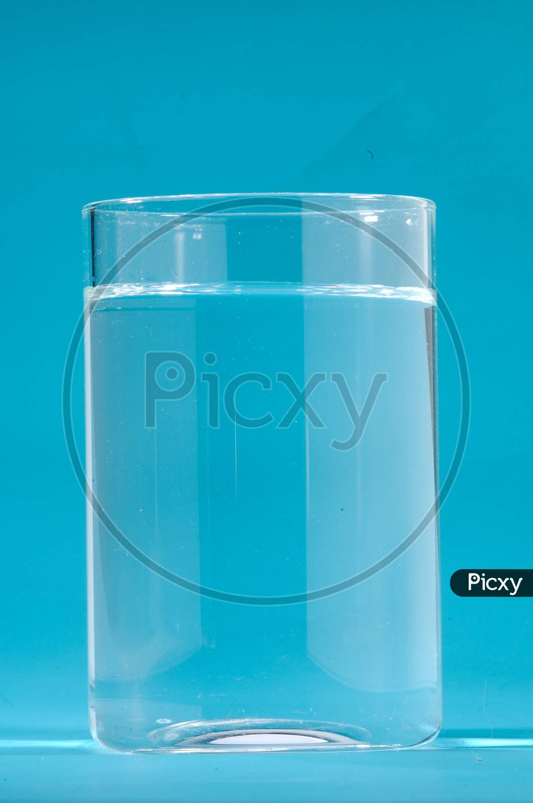Glass Of Water With Blue Background