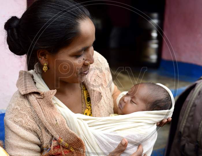 Indian Tribal Mother holding her baby in her hands