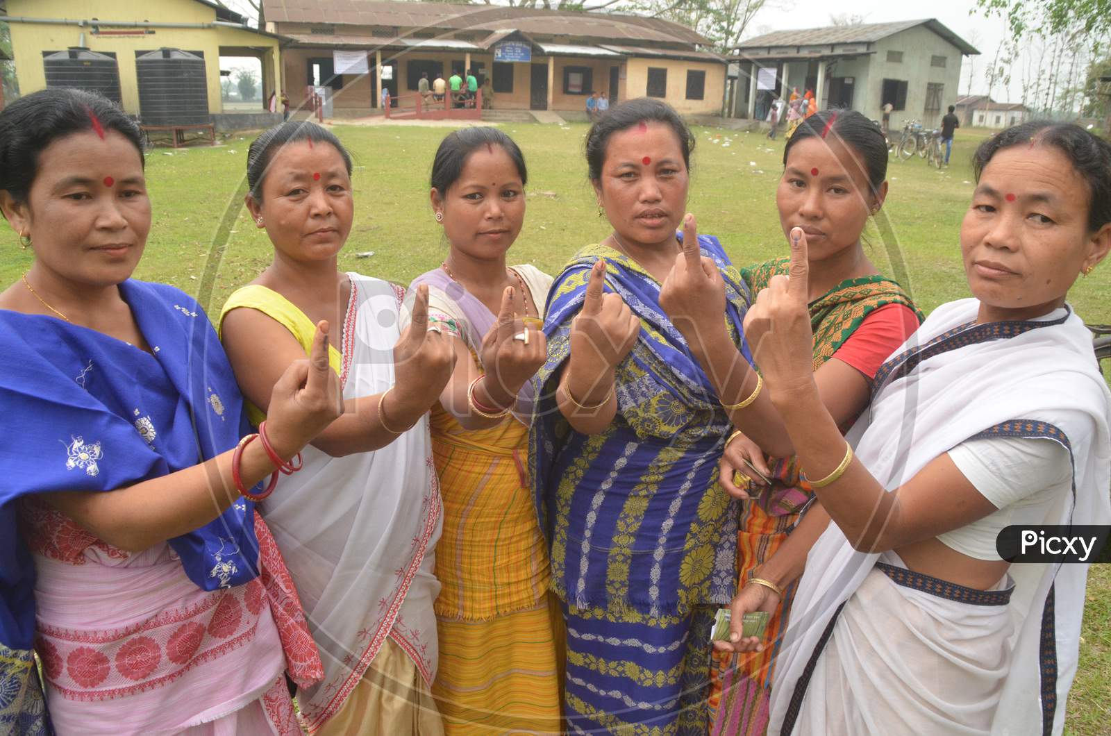 Assamese Woman  Showing  Inked Finger After Casting Vote  in Assembly Elections 2016