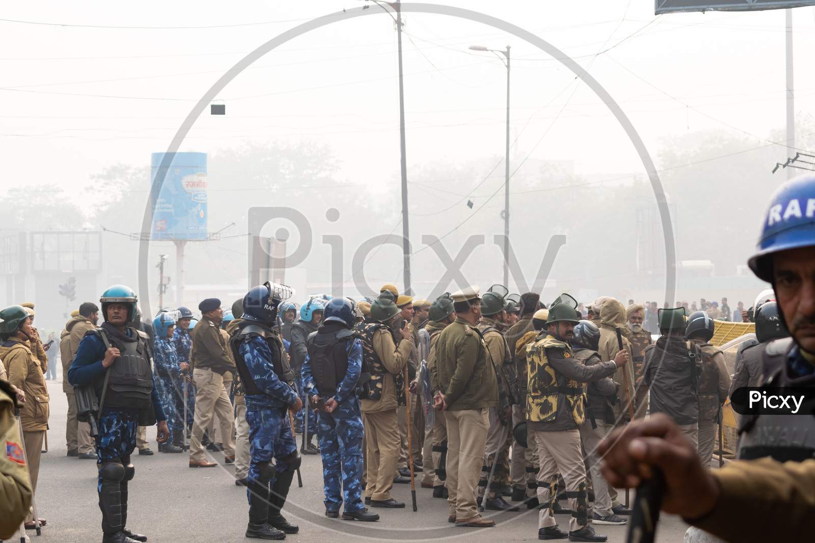Delhi police and RAF behind the barricades to control the situation during Protest Against Caa And Nrc