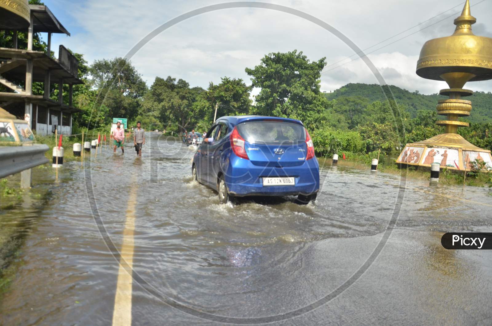 A Car going in a flooded highway in Kaziranga National Park on 26th July 2016