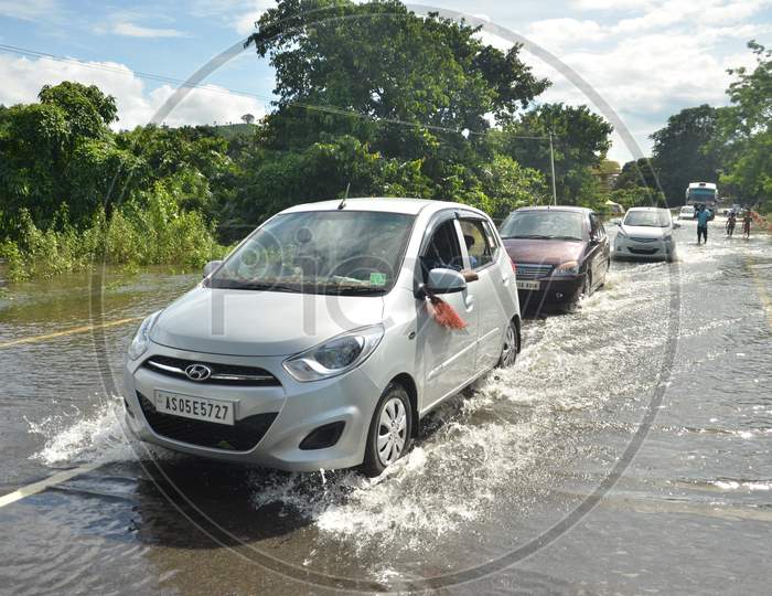 Cars going through a flooded highway in Kaziranga National Park on 26th July 2016