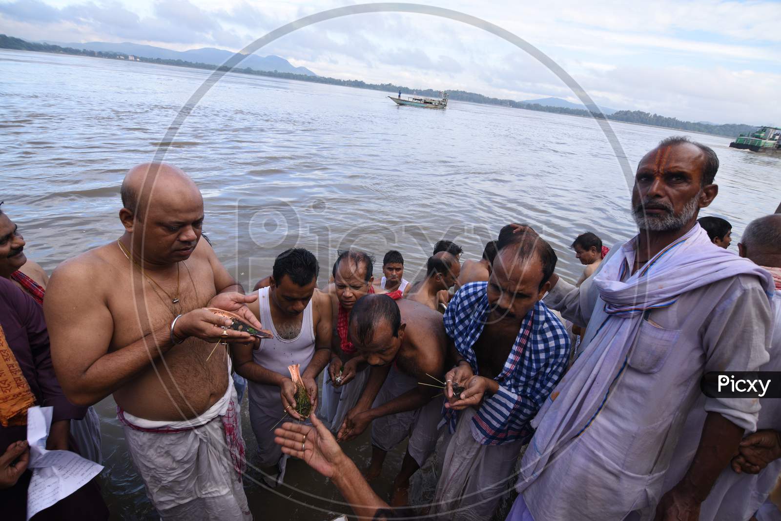 Image Of Hindu Devotees Or People Taking Bath On Holy Bramaputra River In Guwahati On Mahalaya