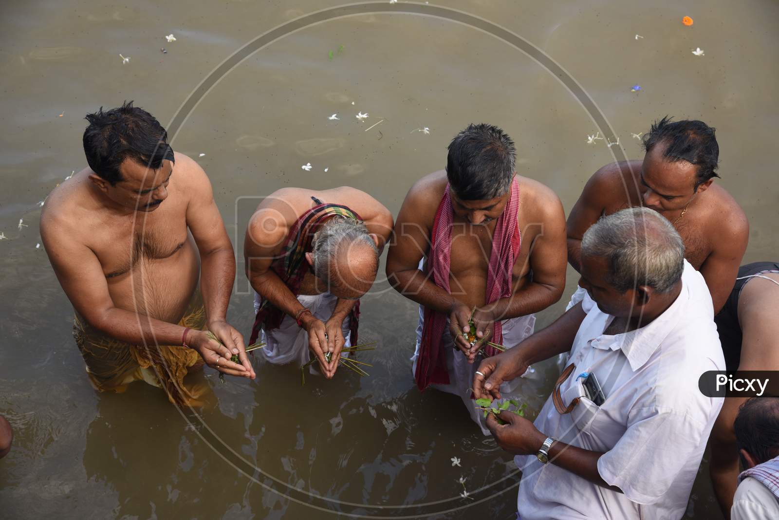 Hindu Devotees Or People Taking Bath On Holy Bramaputra River In Guwahati On Mahalaya  Festival