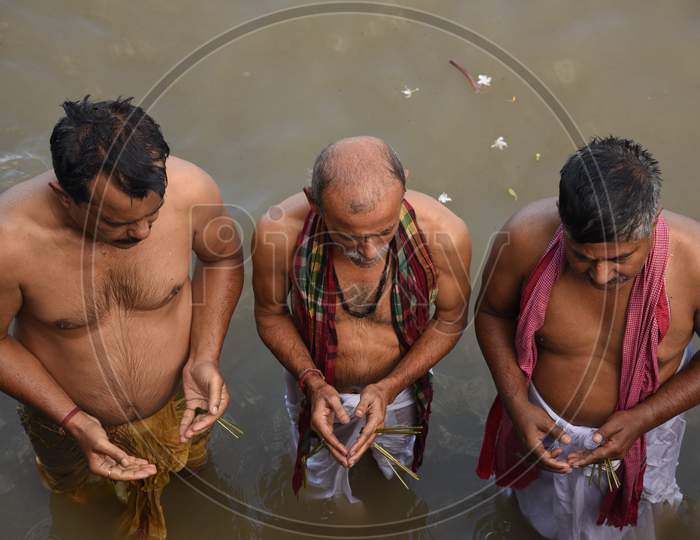 Hindu Devotees Or People Taking Bath On Holy Bramaputra River In Guwahati On Mahalaya  Festival