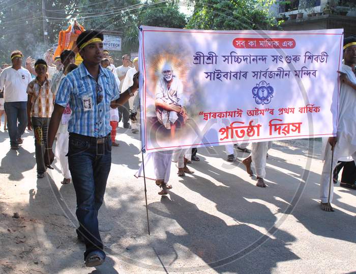 People Taking Out A Cultural Rally During The 1 Th Foundation Day Of  Sri Sri Sasibananda Sat Guru Sai Baba Sarboganin Temple  In Nagaon
