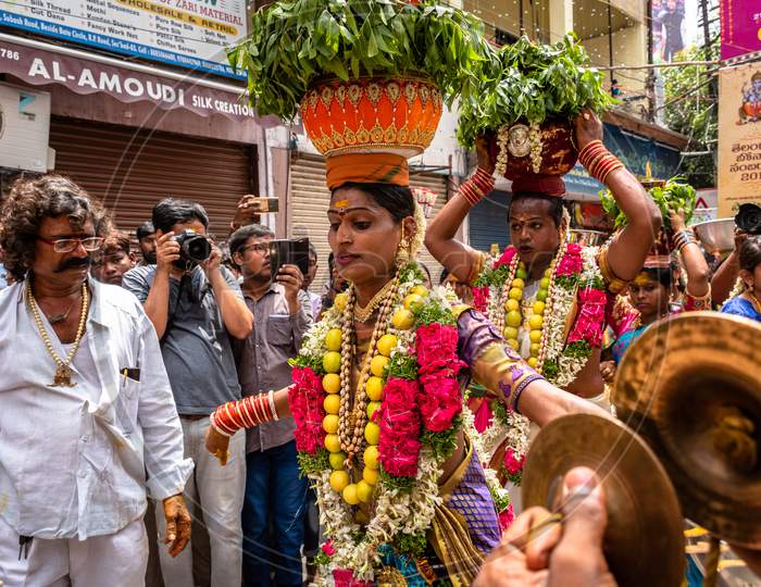 Bonalu Celebrations With Devotees Carrying Bonalu And Dancing