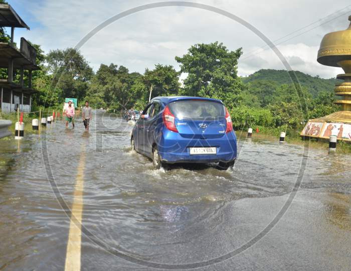 A Car going in a flooded highway in Kaziranga National Park on 26th July 2016
