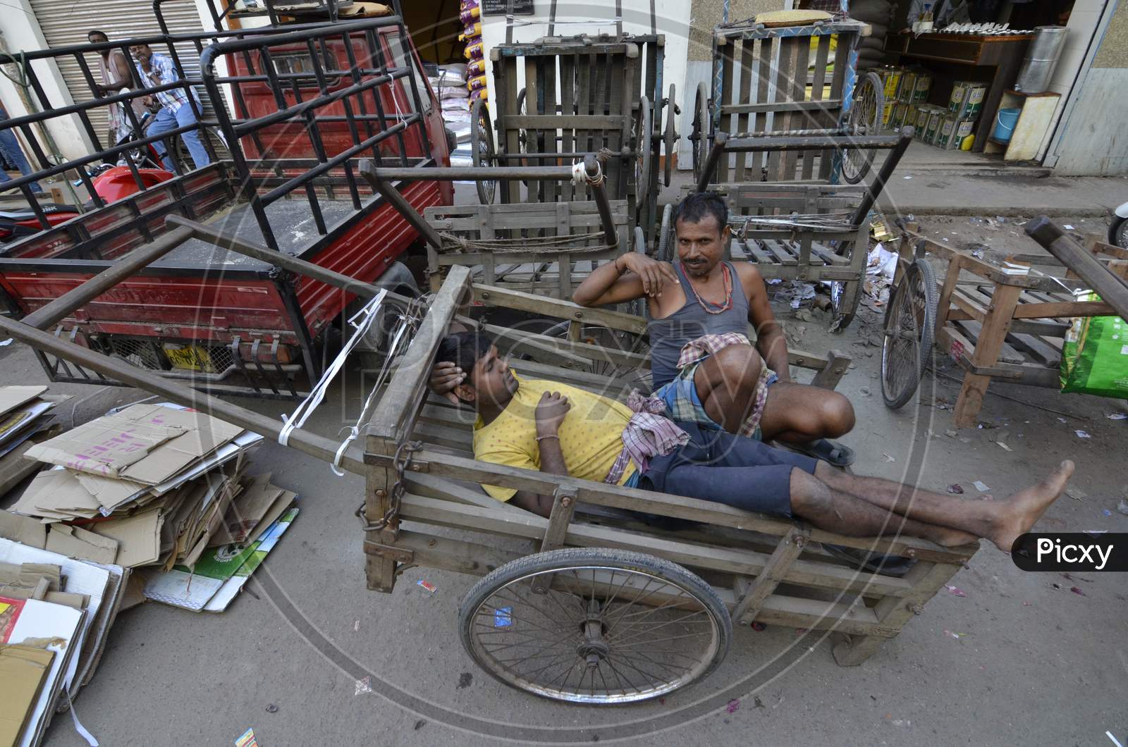 Cart Pullers Taking Rest On Carts in Guwahati Fancy Bazaar , Assam