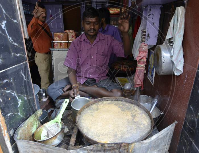 A Tea Vendor Making Tea At a Stall in Guwahati Fancy Bazaar, Assam