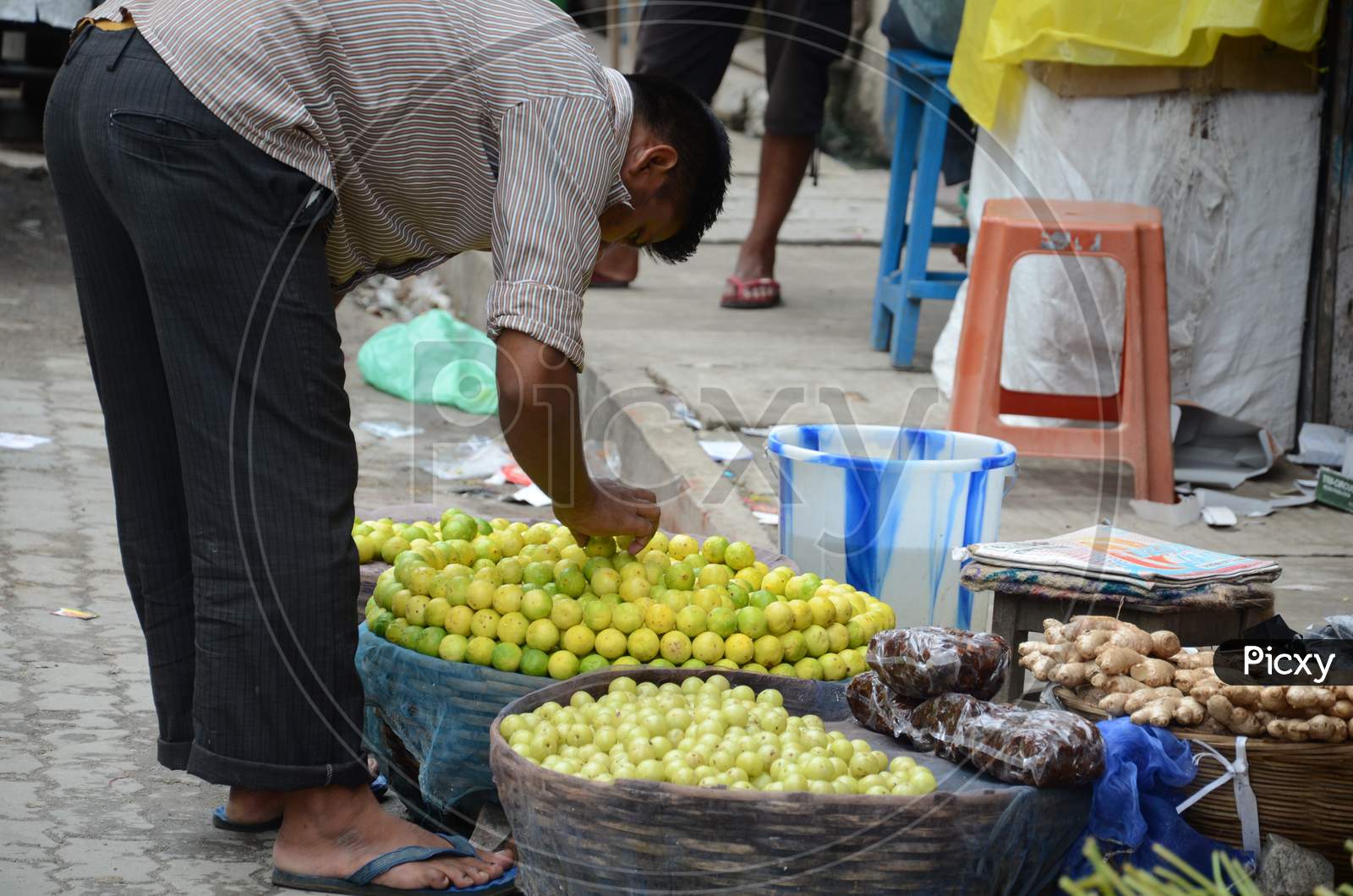 Lemons Vendor in Guwahati Market, Assam