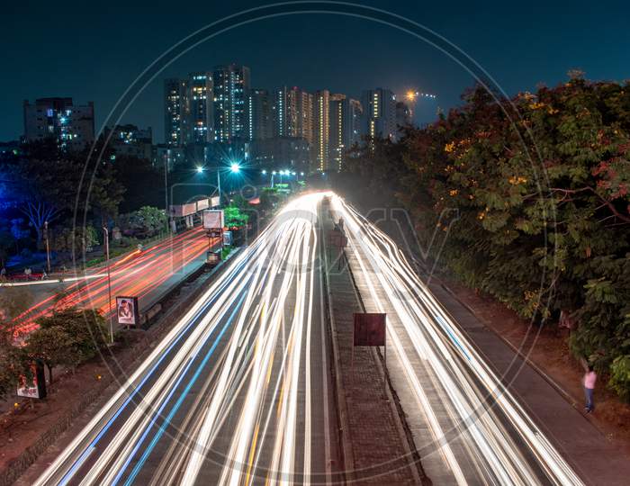 Long Exposure Of Moving Commuting  Vehicles on City Roads