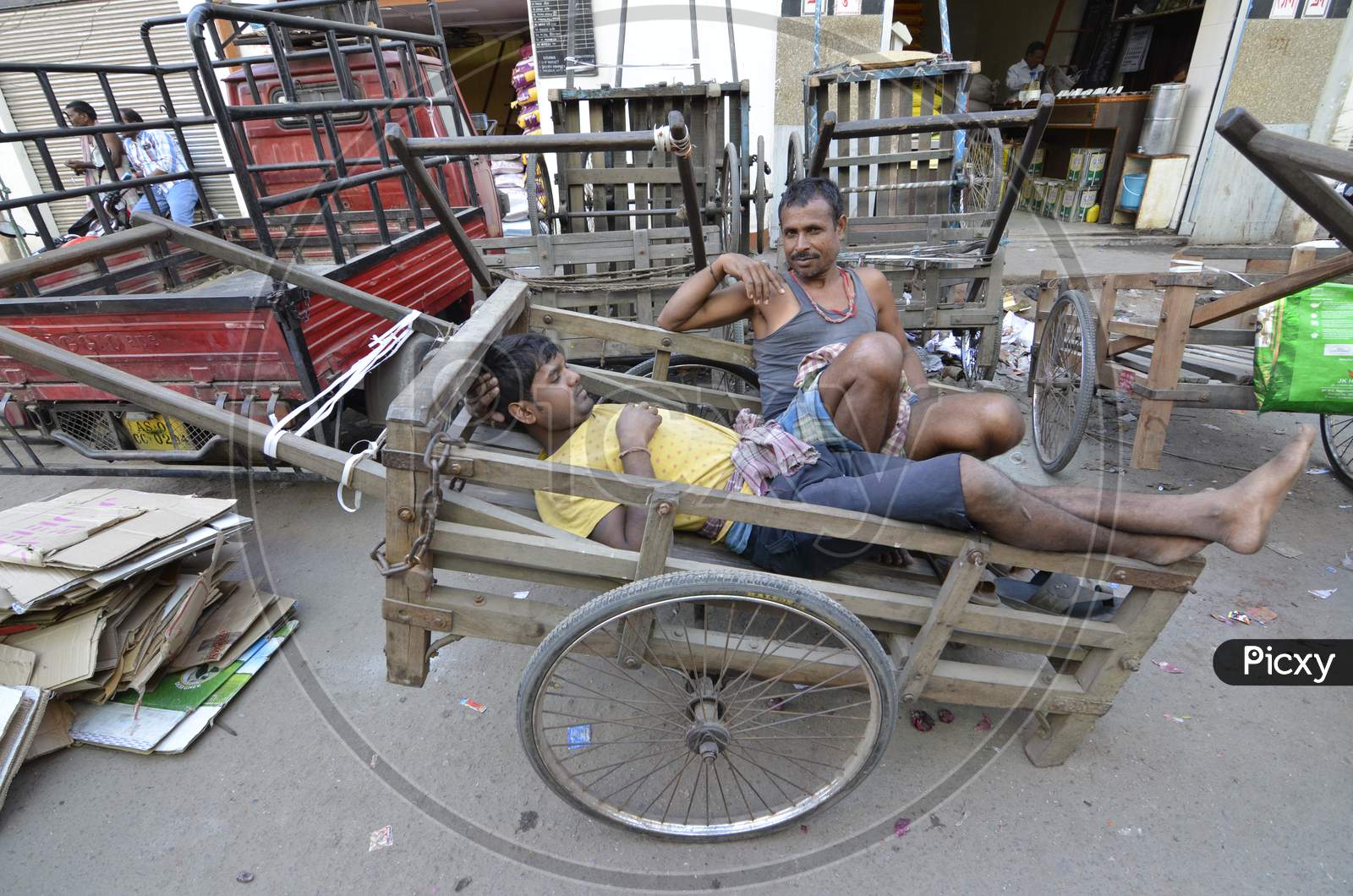 Cart Pullers Taking Rest On Carts in Guwahati Fancy Bazaar , Assam