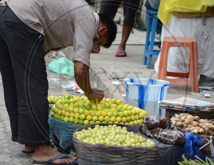 Lemons Vendor in Guwahati Market, Assam