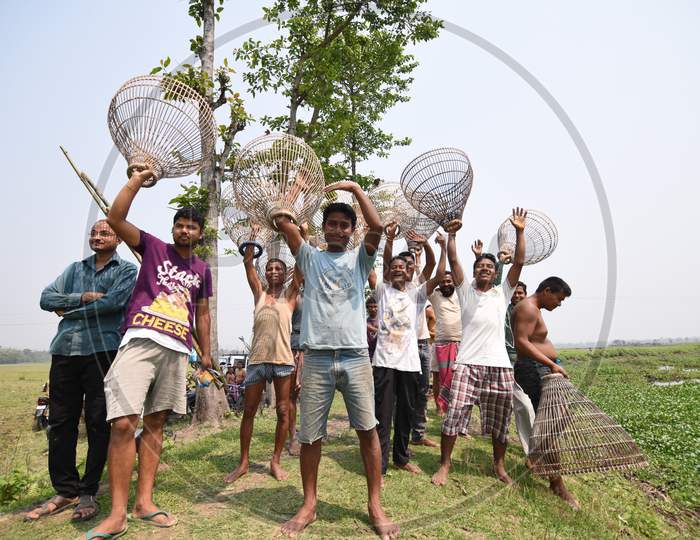 Tribal People Participating In Community Fishing With Nets In Rural Areas of  Nagoan , Assam