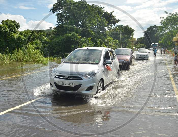 Cars going through a flooded highway in Kaziranga National Park on 26th July 2016