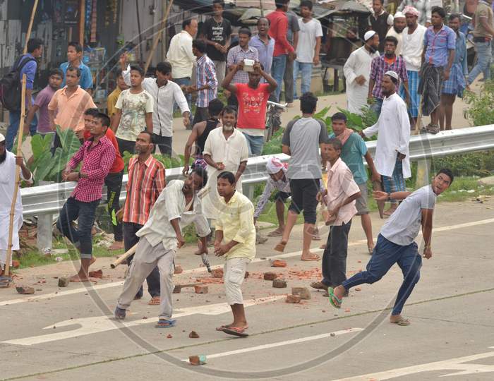 Protester Throw Stones At  Police Not In Picture During A Protest  Demanding Setting Of The Aiims In Central Assam, At Raha In Nagaon District Of Assam On July 15,2016