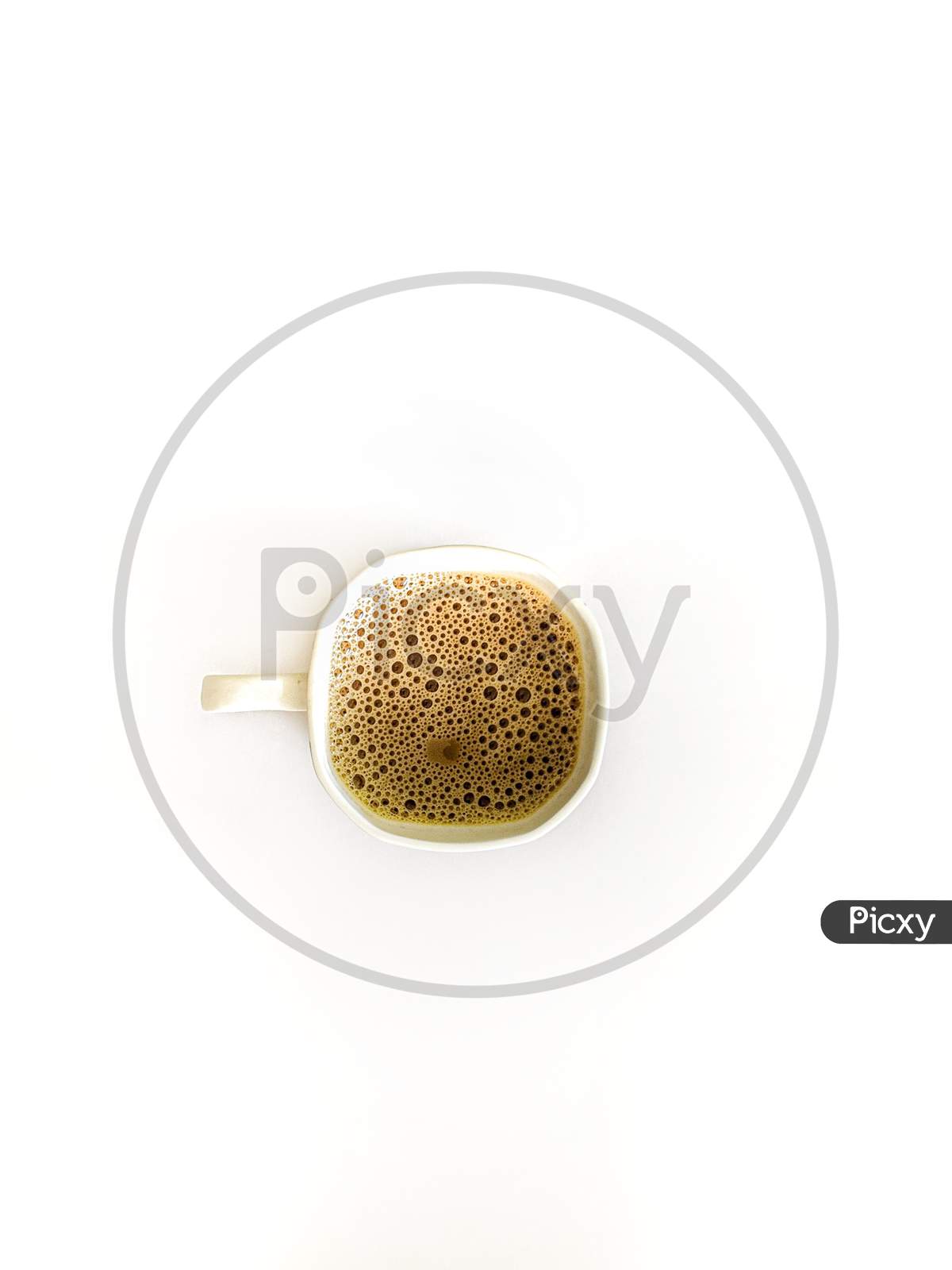Coffee In a Cup Top View Over White Isolated Background