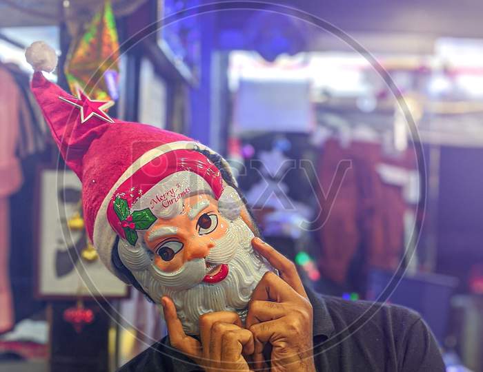 A Man Wearing Santa Claus  Mask