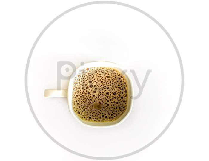 Coffee In a Cup Top View Over White Isolated Background