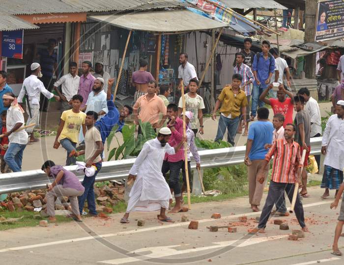 Protester Throw Stones At  Police Not In Picture During A Protest  Demanding Setting Of The Aiims In Central Assam, At Raha In Nagaon District Of Assam On July 15,2016