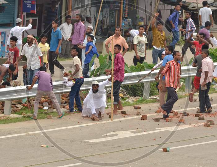 Protester Throw Stones At  Police Not In Picture During A Protest  Demanding Setting Of The Aiims In Central Assam, At Raha In Nagaon District Of Assam On July 15,2016.