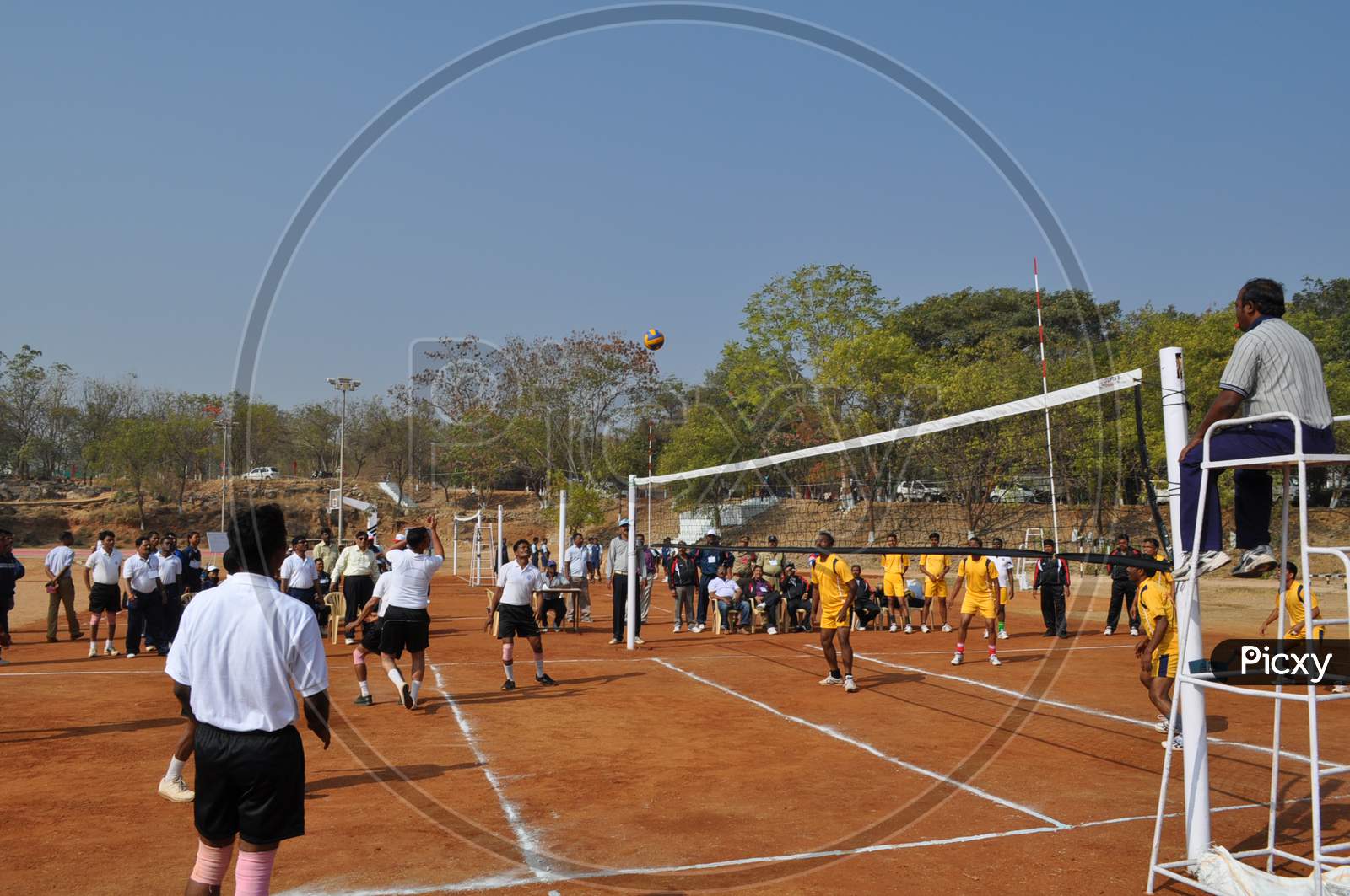 Players Playing Volleyball At a Court